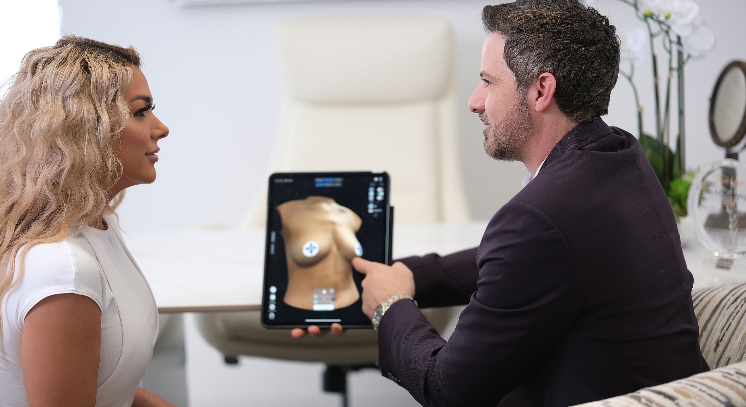 Consultation about cosmetic procedures using tablet.